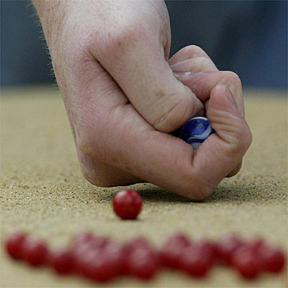 A competitor lines up a shot at the World Marbles Championships /PA